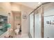 Neat and tidy bathroom with a glass-enclosed shower and toilet at 371 Quane Ave, Spring Hill, FL 34609