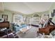 Bright living room with large windows, comfortable seating, and a cozy atmosphere at 371 Quane Ave, Spring Hill, FL 34609