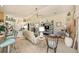 Spacious living room with neutral walls, carpet flooring, ceiling fan, and plenty of natural light at 371 Quane Ave, Spring Hill, FL 34609