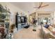 Open living area showcases a vaulted ceiling, ceiling fan, and sliding glass doors to the lanai at 371 Quane Ave, Spring Hill, FL 34609