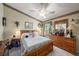 Comfortable main bedroom with a ceiling fan, neutral walls, and carpet flooring at 371 Quane Ave, Spring Hill, FL 34609