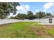 The home has a spacious, private backyard with a grassy lawn at 3909 W Oklahoma Ave, Tampa, FL 33616