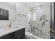 Updated bathroom features marble tile, vanity and brass fixtures at 3909 W Oklahoma Ave, Tampa, FL 33616