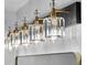 Close up of crystal adorned bathroom lights fixed to a black base with brass colored fittings at 3909 W Oklahoma Ave, Tampa, FL 33616