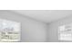 The bright bedroom features large windows and light-colored walls at 3909 W Oklahoma Ave, Tampa, FL 33616