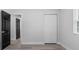 A light and bright bedroom features wood-look flooring and a spacious closet at 3909 W Oklahoma Ave, Tampa, FL 33616