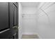 Walk-in closet features a metal shelf and black painted trim at 3909 W Oklahoma Ave, Tampa, FL 33616