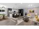 Open-concept living space featuring a modern kitchen, dining area, and comfortable seating at 3909 W Oklahoma Ave, Tampa, FL 33616