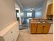 Open concept kitchen featuring a stainless steel sink, white appliances, and an open view to the living room at 4207 S Dale Mabry Hwy # 6212, Tampa, FL 33611