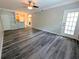 Bright living room with hard surface floors, ceiling fan, neutral paint, and an open floorplan at 4207 S Dale Mabry Hwy # 6212, Tampa, FL 33611