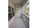 Screened patio with tile floor and white door at 4207 S Dale Mabry Hwy # 6212, Tampa, FL 33611