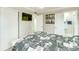 Bedroom featuring light walls, a TV, closet and ensuite bathroom access at 4362 Wesley Ln, North Port, FL 34287