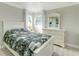 Bright bedroom with white furniture, comfortable bed, and ample natural light at 4362 Wesley Ln, North Port, FL 34287