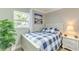 Comfortable bedroom with natural light, a ceiling fan, and views of the outdoors at 4362 Wesley Ln, North Port, FL 34287