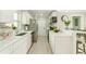 Bright kitchen features stainless steel appliances, ample counter space, and a breakfast bar area at 4362 Wesley Ln, North Port, FL 34287