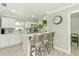 A well-appointed kitchen with a breakfast bar, modern appliances, and sleek white cabinetry at 4362 Wesley Ln, North Port, FL 34287
