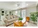 Open living room featuring bright natural light, a ceiling fan, and direct access to the pool at 4362 Wesley Ln, North Port, FL 34287