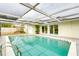 Refreshing screened-in pool features a sunshade and offers private relaxation at 4362 Wesley Ln, North Port, FL 34287