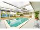 Enclosed pool with clear water and outdoor seating at 4362 Wesley Ln, North Port, FL 34287