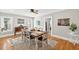 Bright dining room features hardwood floors and a modern ceiling fan with art and a patriotic display at 4820 8Th S Ave, St Petersburg, FL 33711