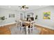 Bright dining room with wood floors, table, and decor at 4820 8Th S Ave, St Petersburg, FL 33711