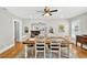 Bright dining room boasts hardwood floors, stylish decor, and a seamless transition into the living area at 4820 8Th S Ave, St Petersburg, FL 33711