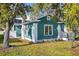 Teal single-story home featuring white trim and a cozy front porch at 4820 8Th S Ave, St Petersburg, FL 33711