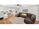 Spacious living room with hardwood floors and a comfortable leather sectional at 4820 8Th S Ave, St Petersburg, FL 33711