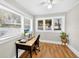 Sunlit office with hardwood floors, computer desk and multiple windows creates a great work environment at 4820 8Th S Ave, St Petersburg, FL 33711