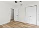 Empty bedroom with wood floors and double doors to a closet at 523 Deville E Dr, Largo, FL 33771
