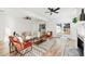 Bright living room with fireplace, contemporary furnishings, and view of french doors to backyard at 523 Deville E Dr, Largo, FL 33771
