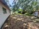 Wide backyard with shady areas and some patio furniture at 5901 N 34Th St, Tampa, FL 33610