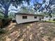 View of the home's backyard showing the home's exterior and fenced boundary at 5901 N 34Th St, Tampa, FL 33610