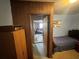 Modest bedroom with an entrance view and open door to another room at 5901 N 34Th St, Tampa, FL 33610