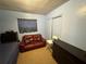 Bedroom featuring blue walls, dark furnishings and an intimate setting at 5901 N 34Th St, Tampa, FL 33610