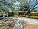 Charming single-story home featuring brickwork and mature trees in a well-maintained front yard at 5901 N 34Th St, Tampa, FL 33610
