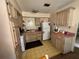Functional kitchen featuring essential appliances and ample cabinet space ready for culinary endeavors at 5901 N 34Th St, Tampa, FL 33610