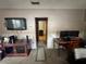 Inviting living room area with home office and view into another room at 5901 N 34Th St, Tampa, FL 33610