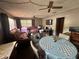 View of the combined living and dining space featuring a ceiling fan at 5901 N 34Th St, Tampa, FL 33610
