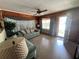 Bright living room with a sofa set, classic ceiling fan and wooden accents creating a warm ambiance at 5901 N 34Th St, Tampa, FL 33610