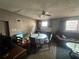 Cozy living and dining area featuring a kitchen and ceiling fan at 5901 N 34Th St, Tampa, FL 33610
