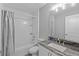 White bathroom with a shower/tub combo, a marble countertop and tile backsplash at 6103 Fairway Dr, Ridge Manor, FL 33523