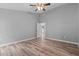 Spacious bedroom with wood-look floors and an open doorway at 6103 Fairway Dr, Ridge Manor, FL 33523
