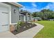 Exterior view of a home featuring stone accents, fresh landscaping, and a well-maintained lawn at 6103 Fairway Dr, Ridge Manor, FL 33523