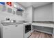 Convenient laundry room with granite countertop, modern appliances, and shelving at 6103 Fairway Dr, Ridge Manor, FL 33523