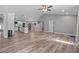 Bright, open-concept layout seamlessly connects the living space with the modern kitchen at 6103 Fairway Dr, Ridge Manor, FL 33523