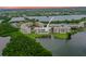 Aerial view of the condo complex, lake, and surrounding greenery at 6450 Shoreline Dr Dr # 9202, St Petersburg, FL 33708