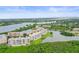 Overhead view of the condo complex near a beautiful waterfront, enveloped by lush greenery and landscaping at 6450 Shoreline Dr Dr # 9202, St Petersburg, FL 33708