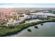 Wide aerial view of waterfront condos nestled in a scenic setting of lakes and lush trees at 6450 Shoreline Dr Dr # 9202, St Petersburg, FL 33708