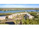 Stunning aerial view of waterfront condos, lush landscaping, and serene bayou setting at 6450 Shoreline Dr Dr # 9202, St Petersburg, FL 33708